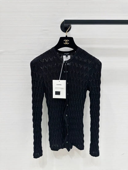 Chanel 26B black cardigan with green buttons