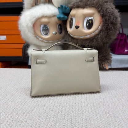 Hermes Kelly pochette craie Swift leather champagne gold hardware