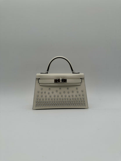 Hermès Kelly 20 Clouté Cream PHW G 2026