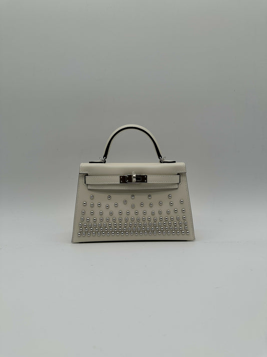 Hermès Kelly 20 Clouté Cream PHW G 2026