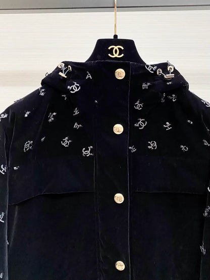 Chanel ski collection, velvet embroidered logo hooded down jacket