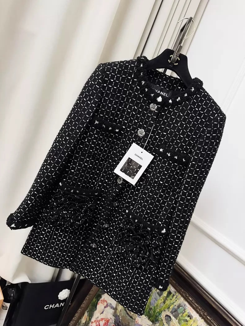 Chanel 23K black tweed jacket with white stitching