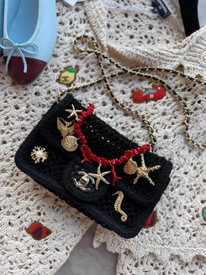 Chanel 26M black knit bag with gold ocean charms and red corals