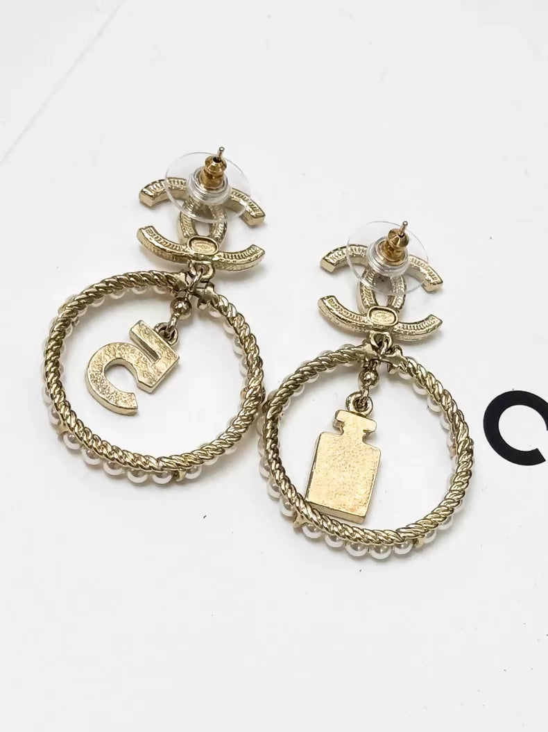Chanel gold circle pearl pendant earrings