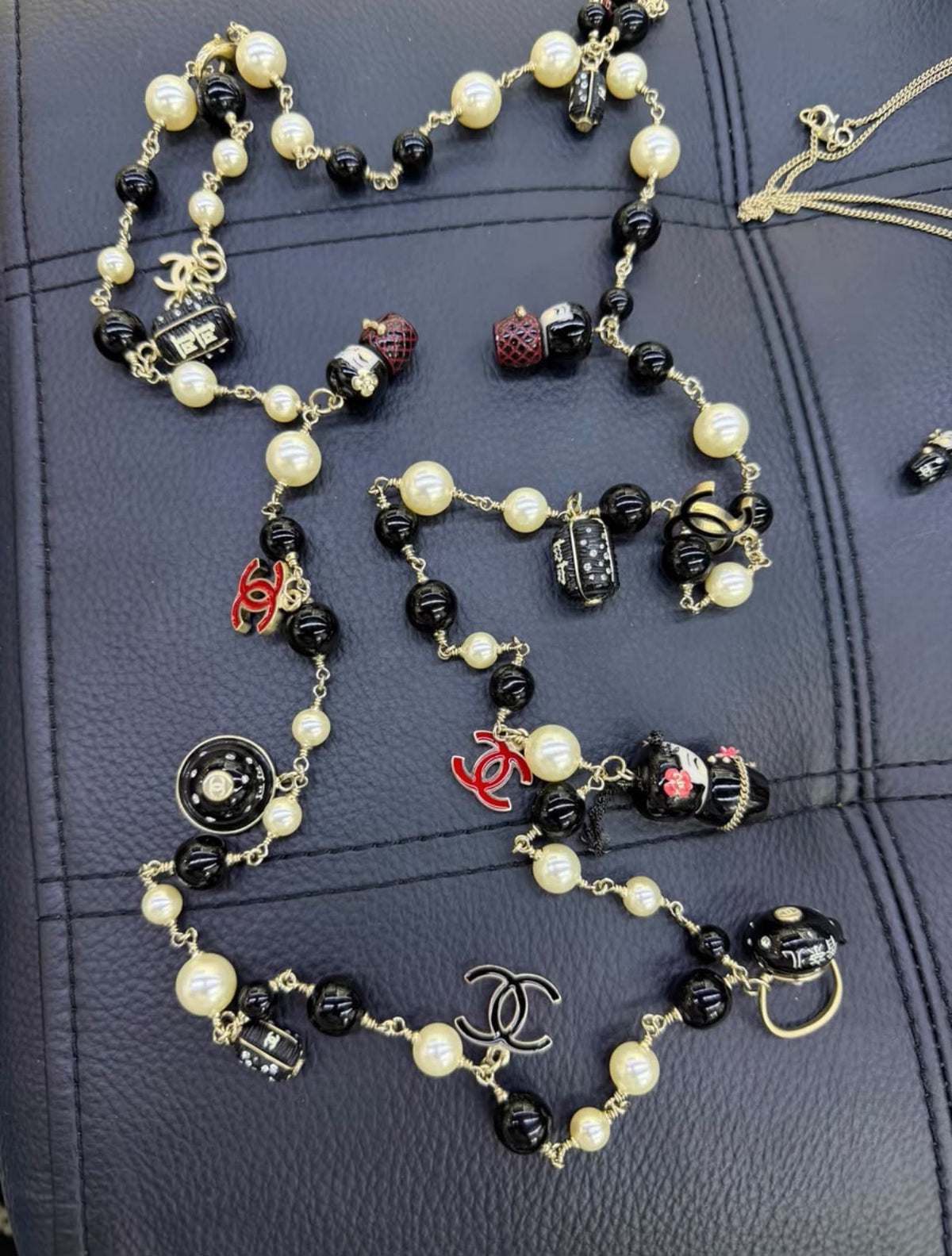 Chanel 10A Paris Shanghai Matryoshka Doll Pearl Charm Necklace/Belt  — Ultra-Rare Collector Piece