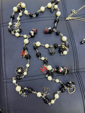 Chanel 10A Paris Shanghai Matryoshka Doll Pearl Charm Necklace/Belt  — Ultra-Rare Collector Piece