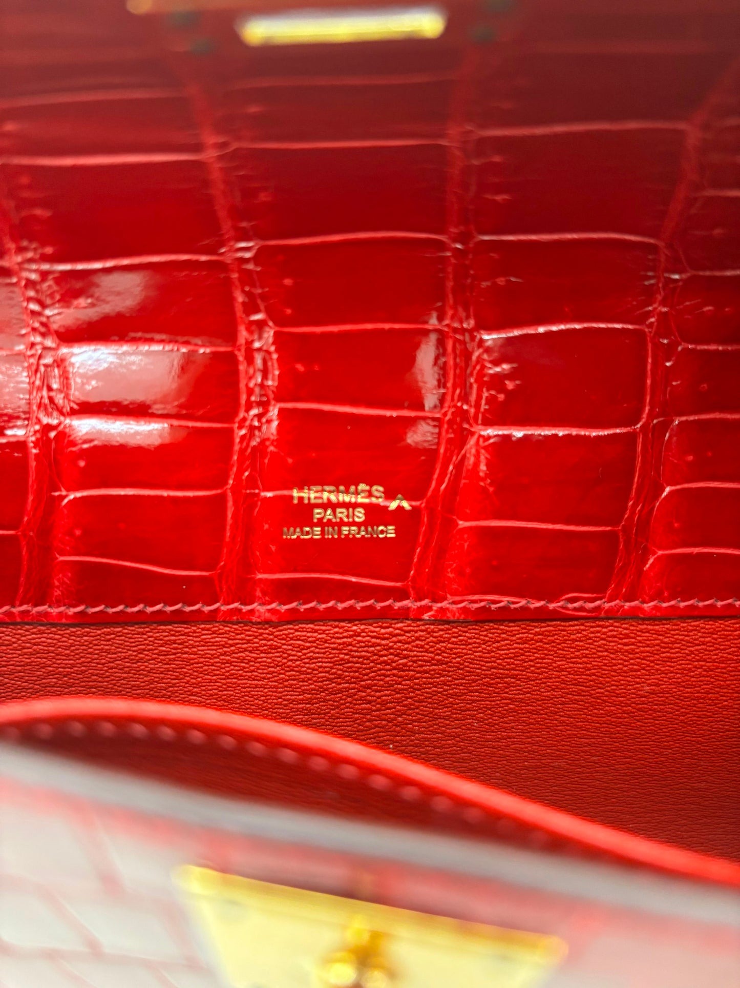 Hermes Kelly cut Braise shiny porosus crocodile leather gold hardware