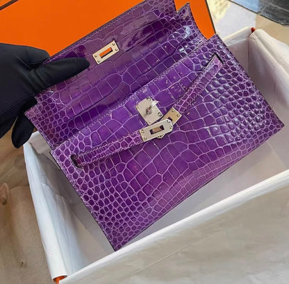 Hermes Kelly pochette Ultraviolet Shiny crocodile leather palladium hardware