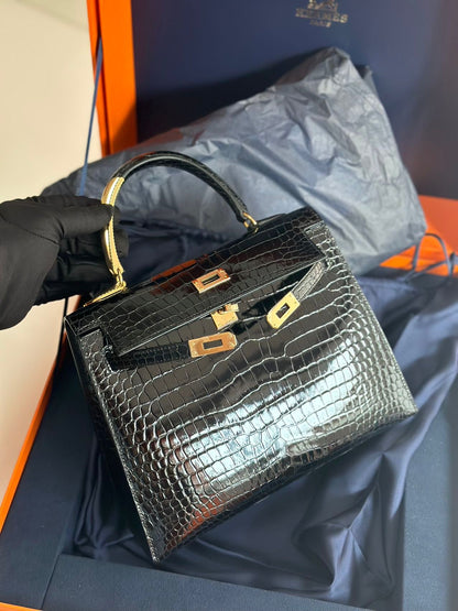 Hermès Kelly Midas 25 Noir Shiny Crocodile Porosus 18k yellow gold hardware & handle
