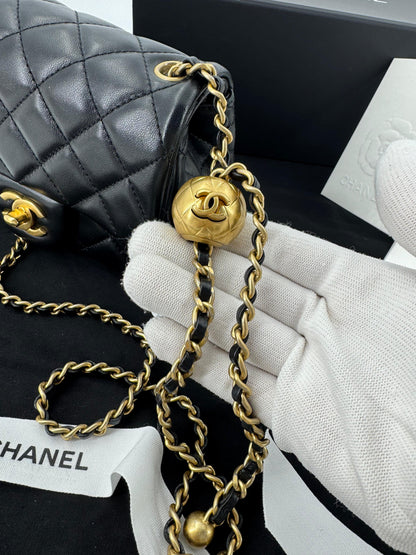 Chanel black mini flap bag with gold hardware
