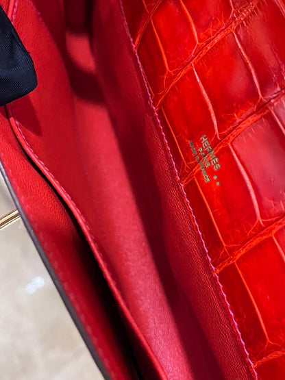 Hermes Kelly cut red shiny crocodile leather gold hardware