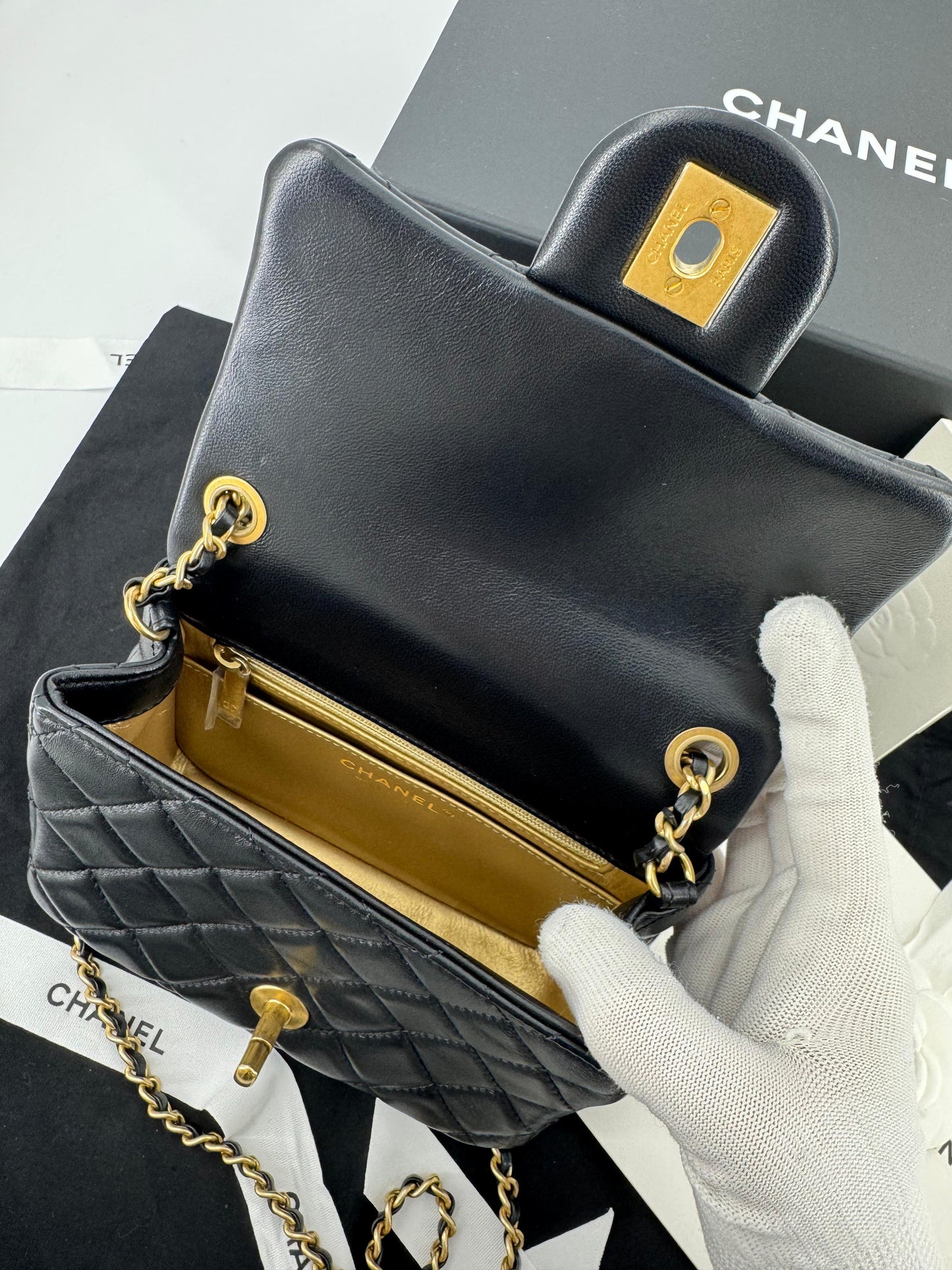 Chanel black mini flap bag with gold hardware