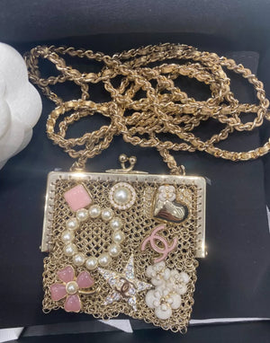 CHANEL 22 mini embellished framed pouch bag