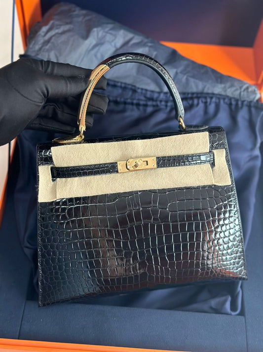 Hermès Kelly Midas 25 Noir Shiny Crocodile Porosus 18k yellow gold hardware & handle