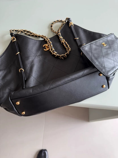 Large black and gold Chanel 25 hobo bag