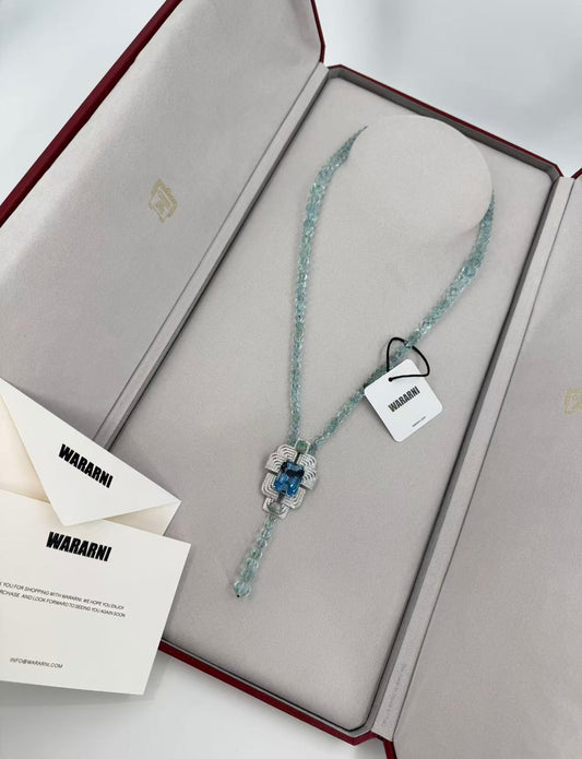 Cartier High Jewelry Necklace - Main stone: 37-carat aquamarine; two opals; chain beads: topaz.
