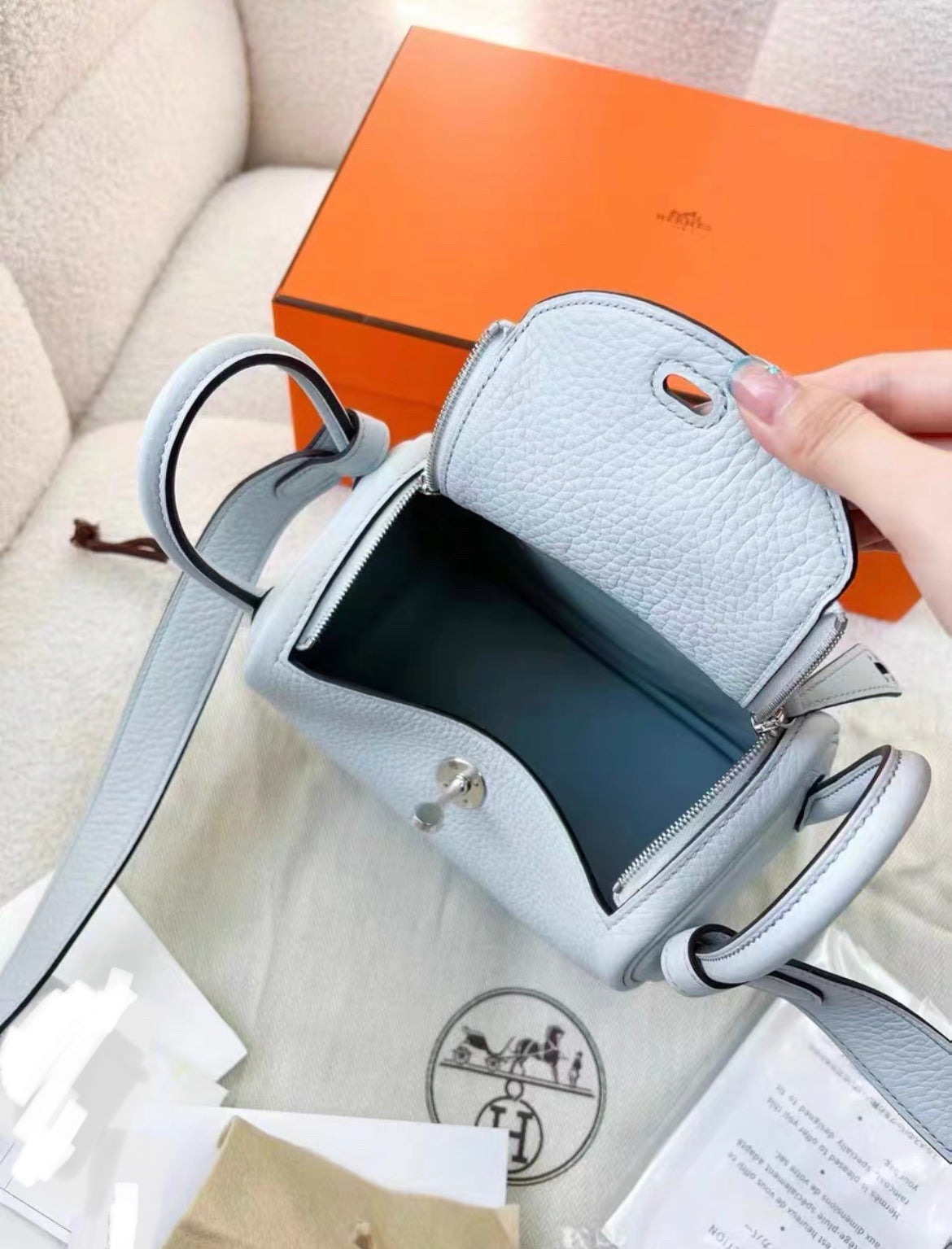 HERMÈS Mini Lindy shoulder bag in Bleu Pale Taurillon Clemence leather with Palladium hardware