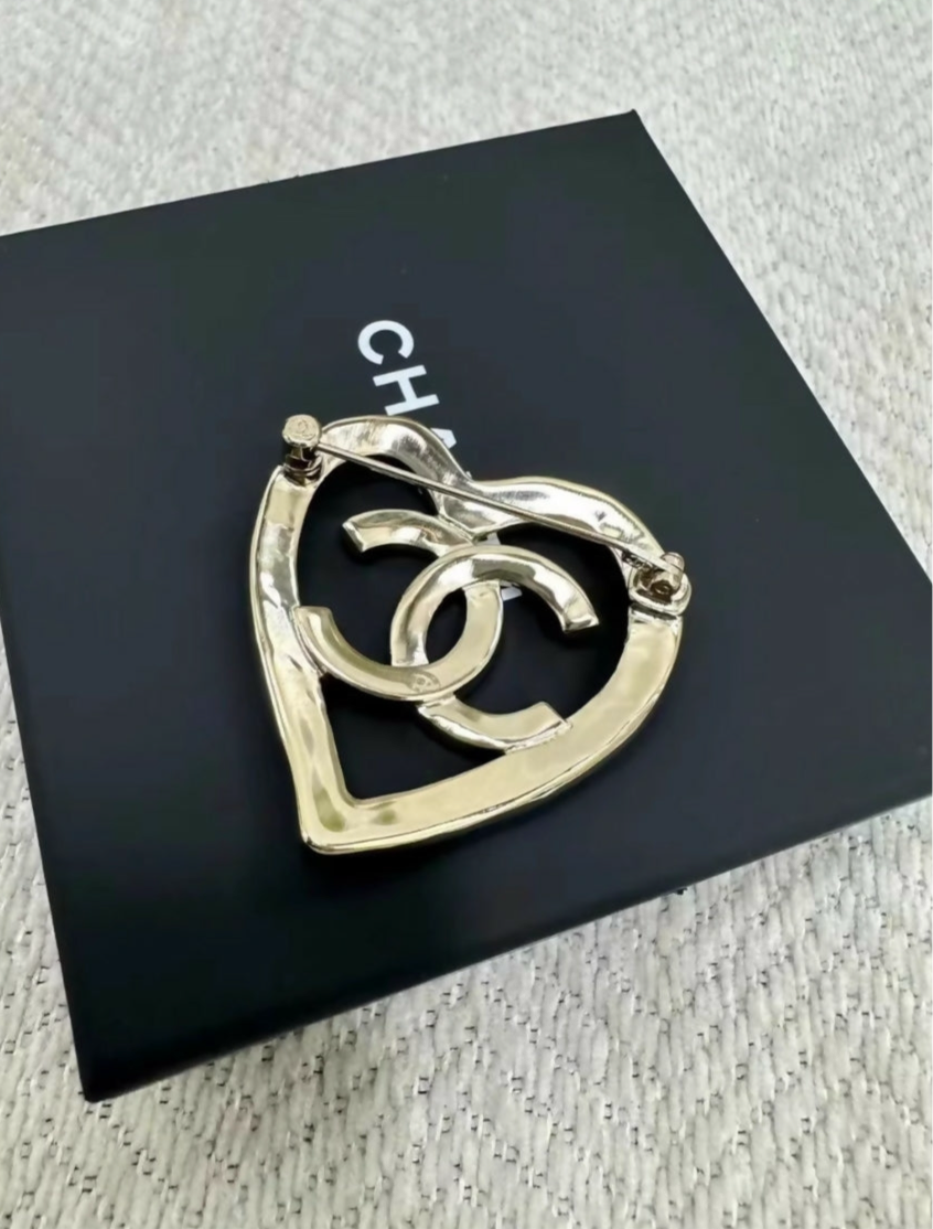 Chanel 22P gold hollow heart brooch