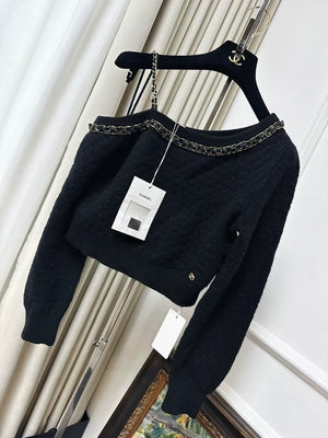 Chanel 23B black cashmere sweater, adorned with chains, pearls and sequins