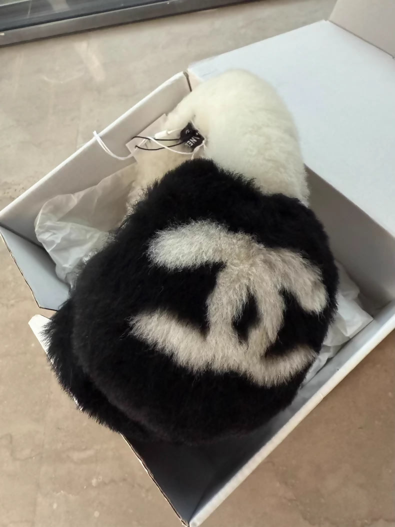 Chanel 25N black and white earmuffs