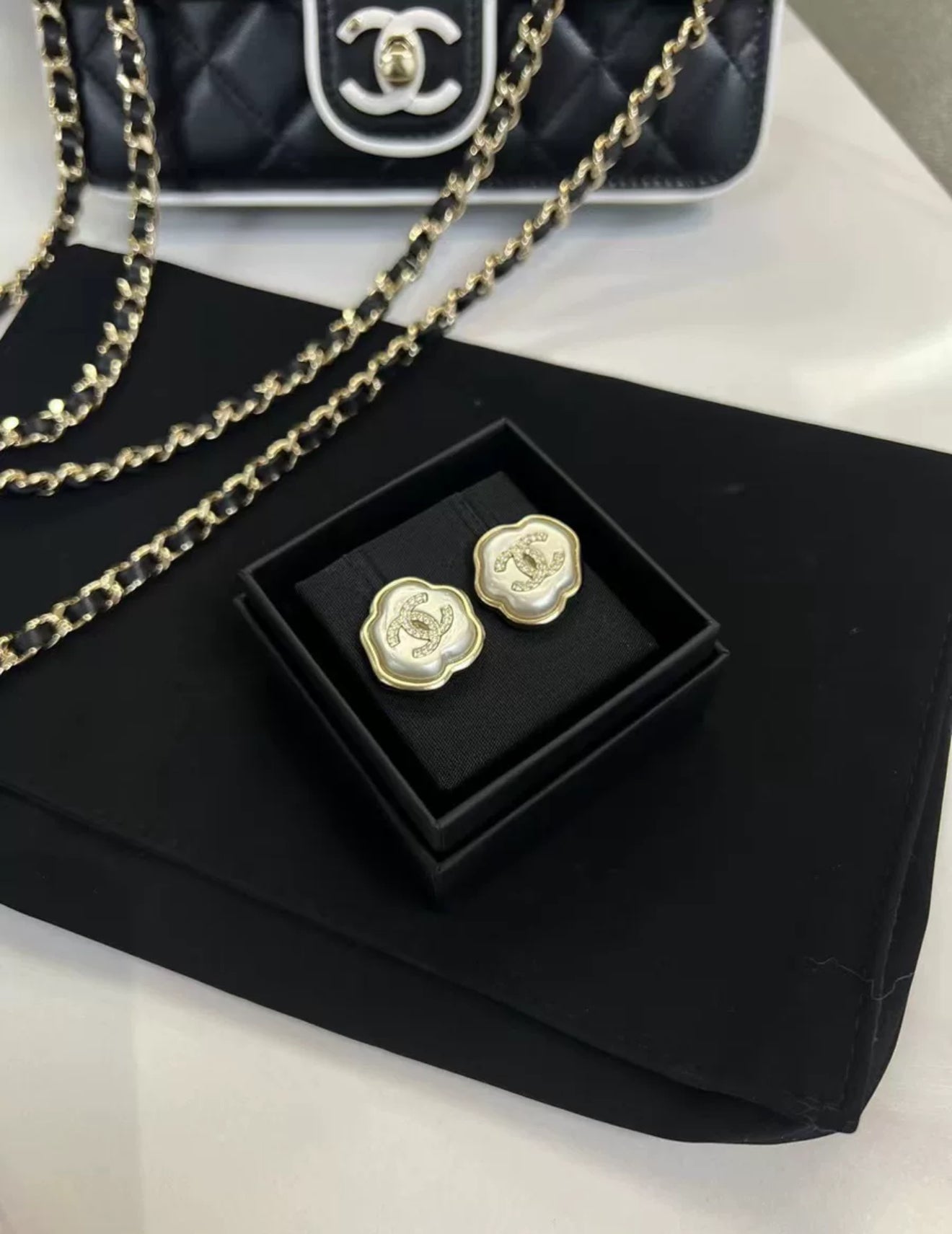 Chanel 25A mother-of-pearl cloud earrings