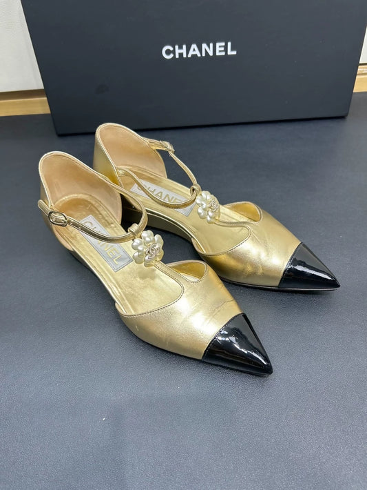 Chanel black and gold camellia shoes