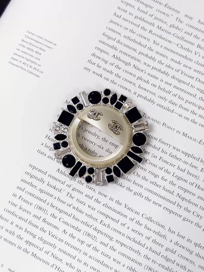 Chanel 16K black and white double C sunflower brooch