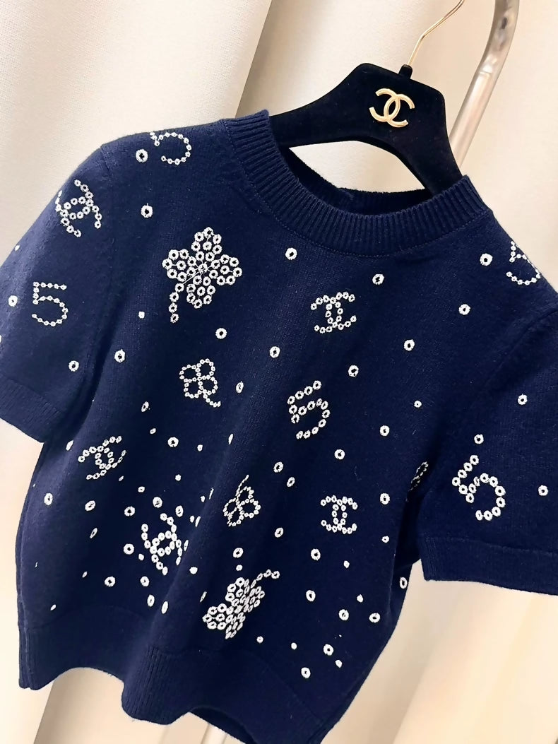 Chanel 24P navy blue, multi-element, knit cardigan.