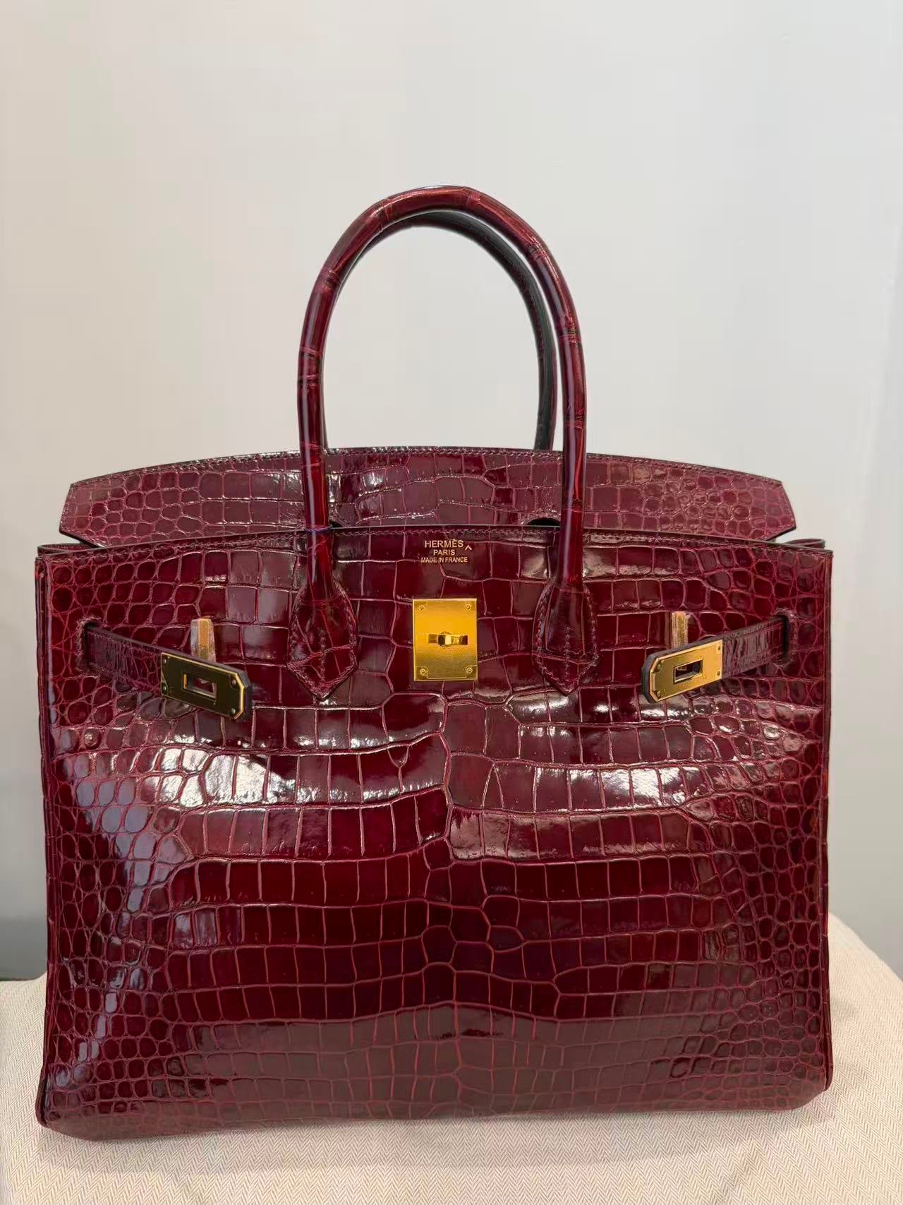 Rare Hermes Birkin 35 shiny Porosus Bordeaux Shiny Porosus Crocodile leather Gold hardware