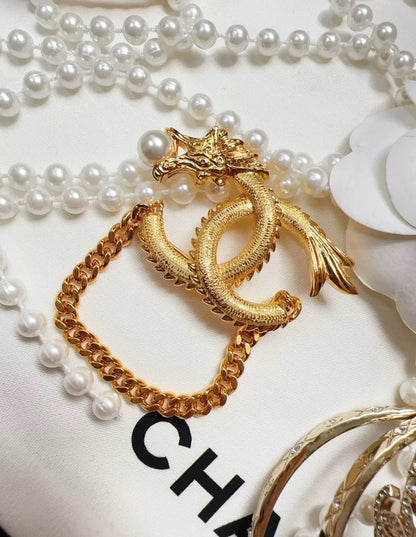 Chanel 24 dragon brooch