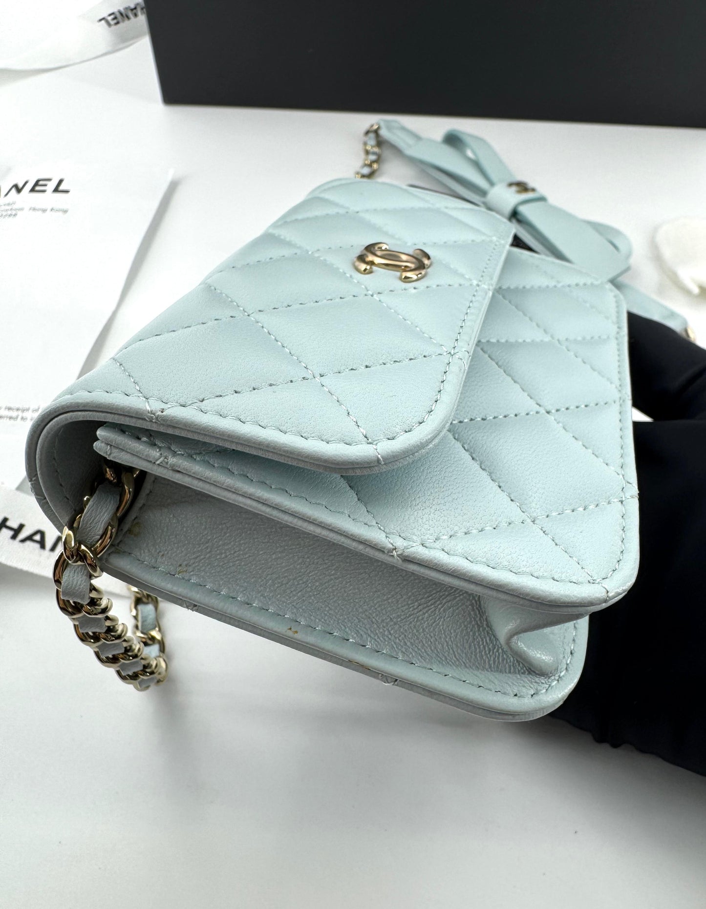 Chanel baby blue quilted leather coin purse with gold chain strap and a bow
