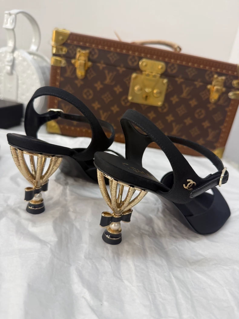 Chanel Métiers d'Art black and gold high heels with a stunning bow