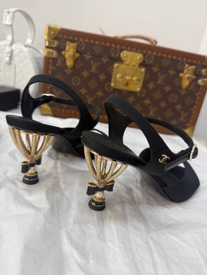 Chanel Métiers d'Art black and gold high heels with a stunning bow