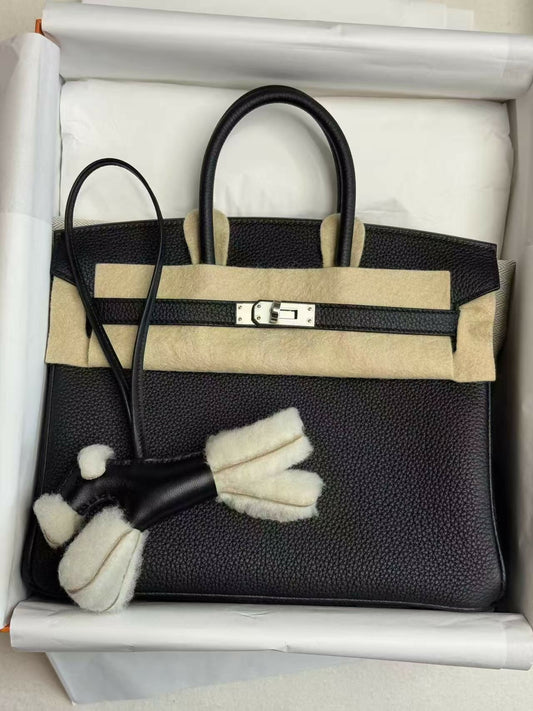 Black Birkin handbag in grained leather with palladium hardware, twin rolled handles, clochette and keys