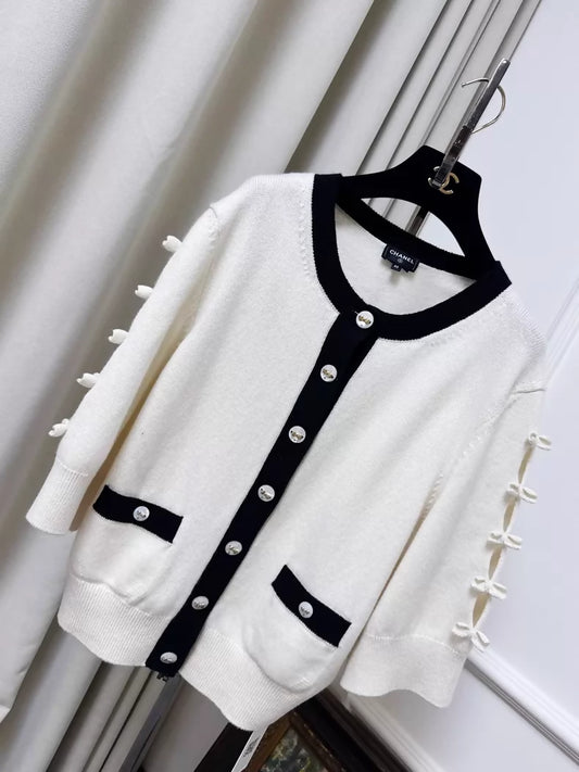 Chanel 25k beige and black knit cardigan with bow and gold buttons