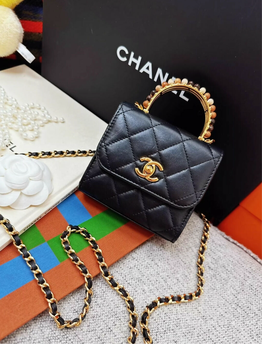 Chanel 23a Black Leather mini bag with gold top handle