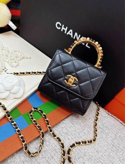 Chanel 23a Black Leather mini bag with gold top handle