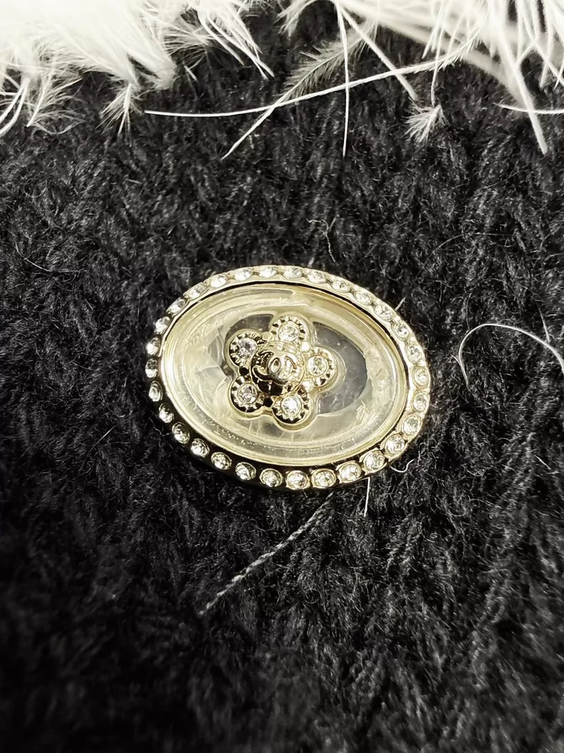 Chanel 23K white ostrich feather black camellia sweater