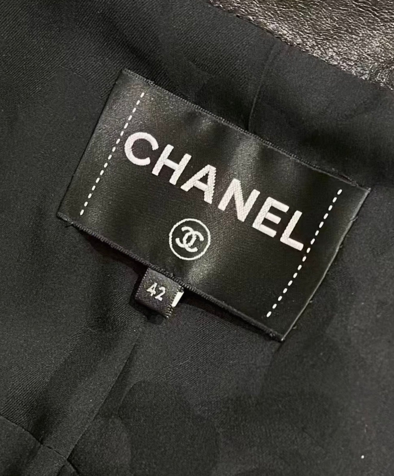 Chanel 24B black leather jacket with chain