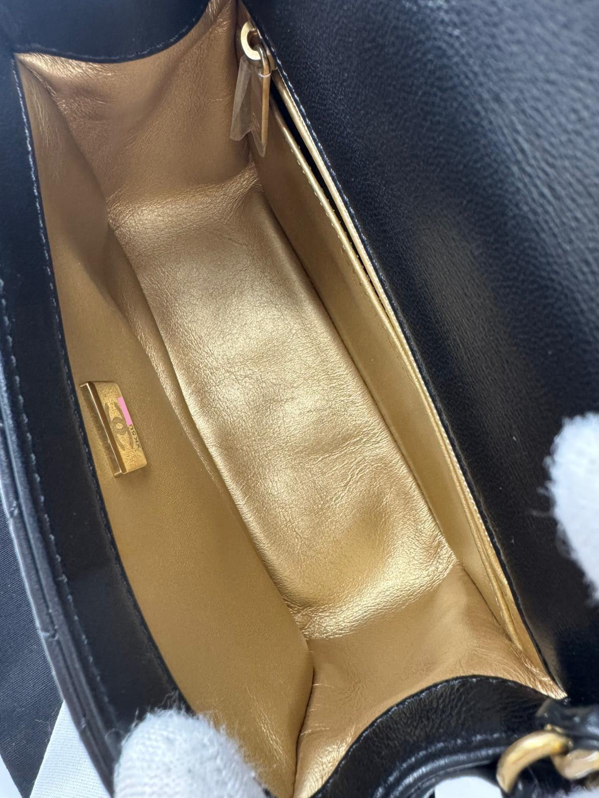 Chanel black mini flap bag with gold hardware