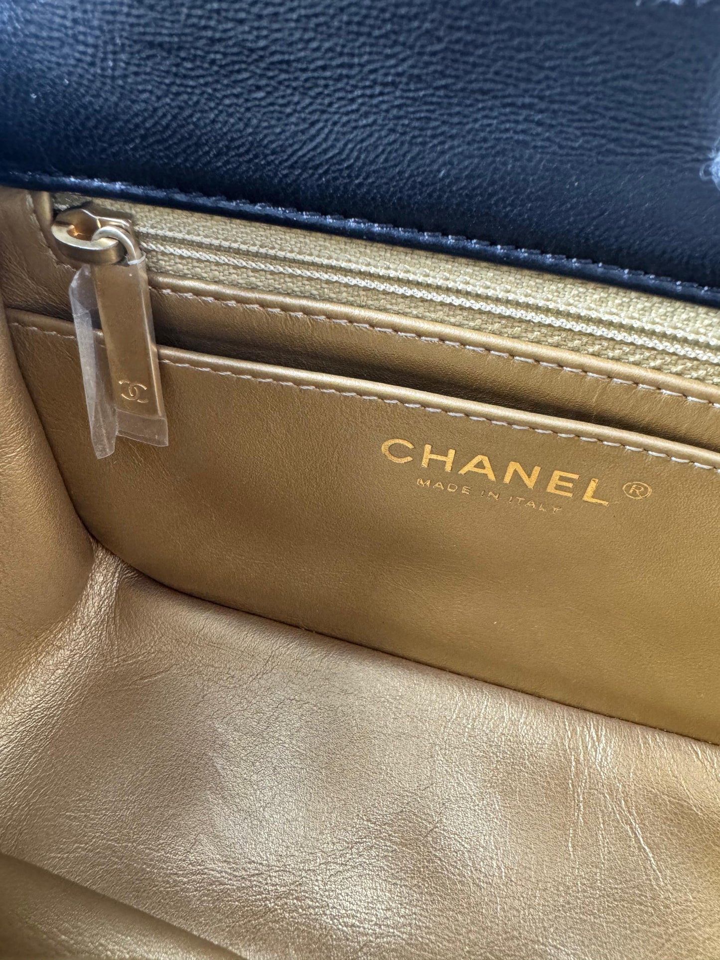 Chanel black mini flap bag with gold hardware