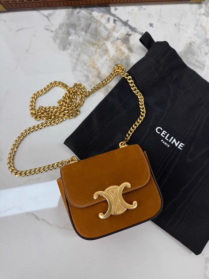 Celine
s new gold mini calfskin chain crossbody/shoulder bag with gold hardware.