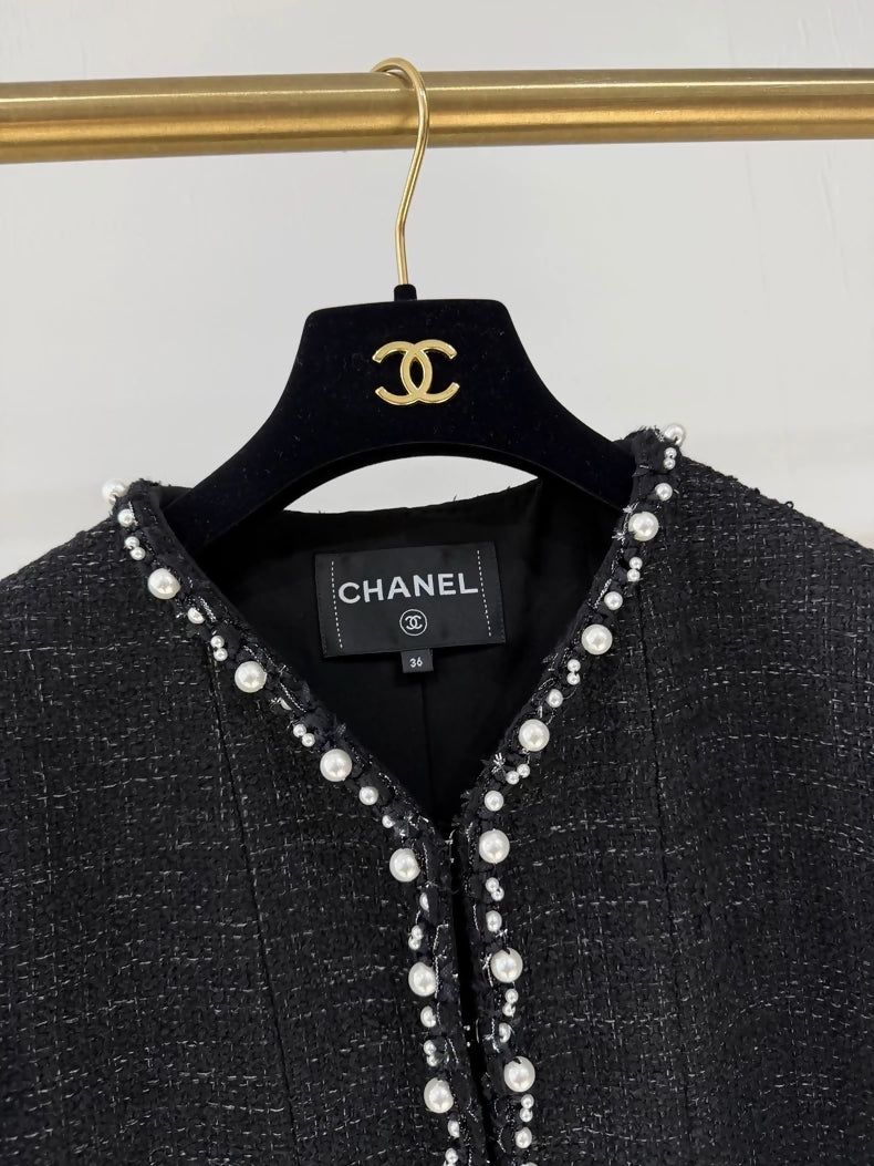 Chanel 25P pearl-trimmed black jacket