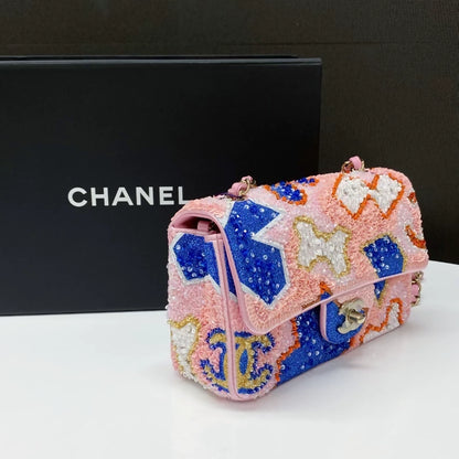 CHANEL 23A featuring colorful beaded sequins and heavy embroidery