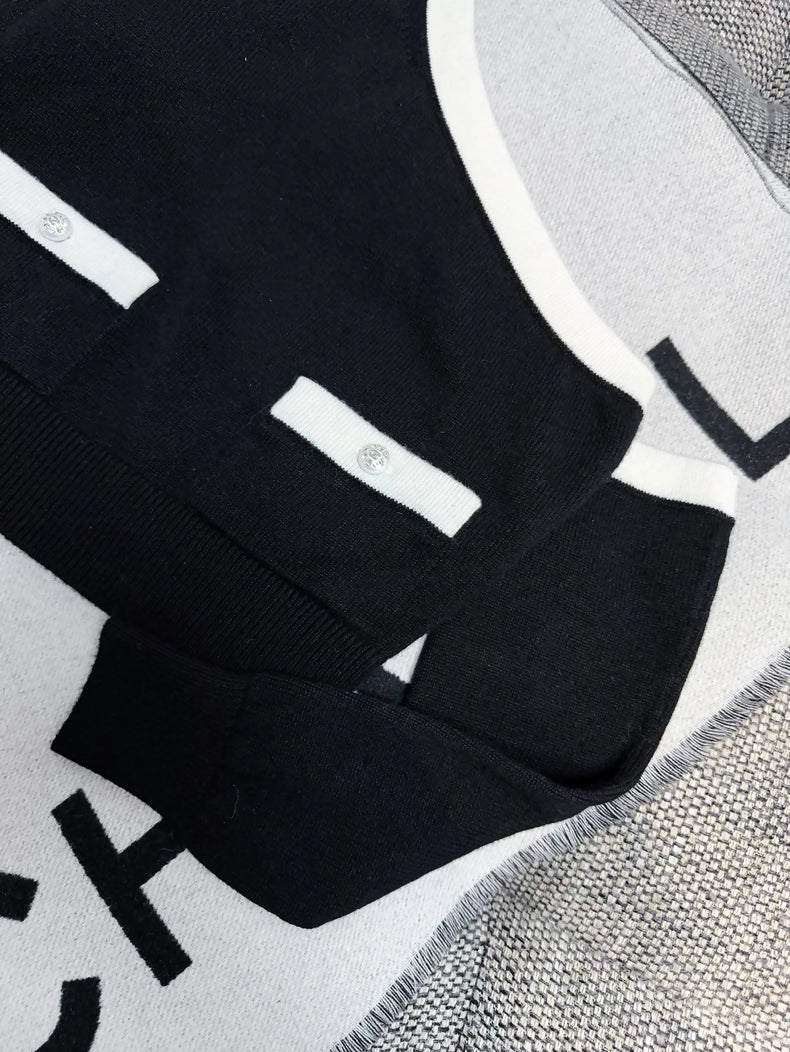 Chanel 23s Black and White Off-the-Shoulder Cashmere Sweater