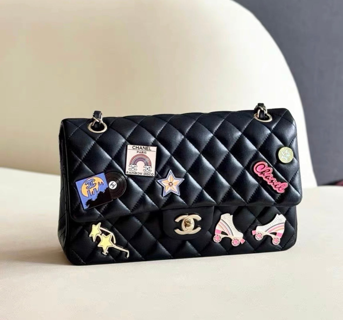 Chanel 24C Flap Bag in Black Leather Embellished with Charms