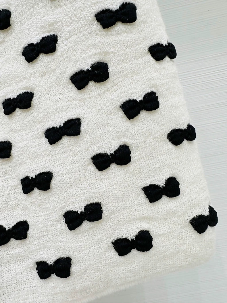 Chanel 25K white and black bow-tie midi skirt