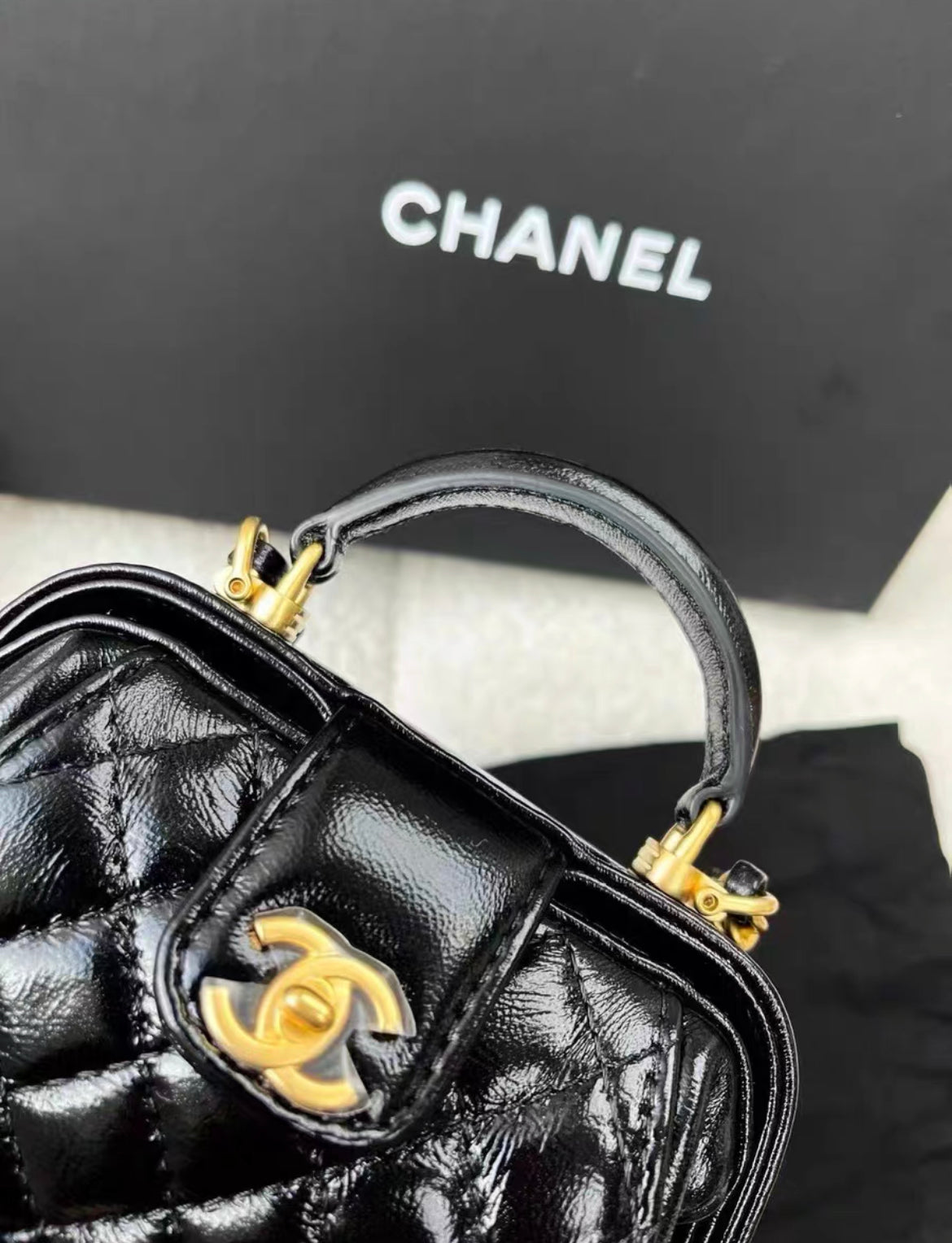 Chanel 24A Black shiny lambskin cocodoc mini bag