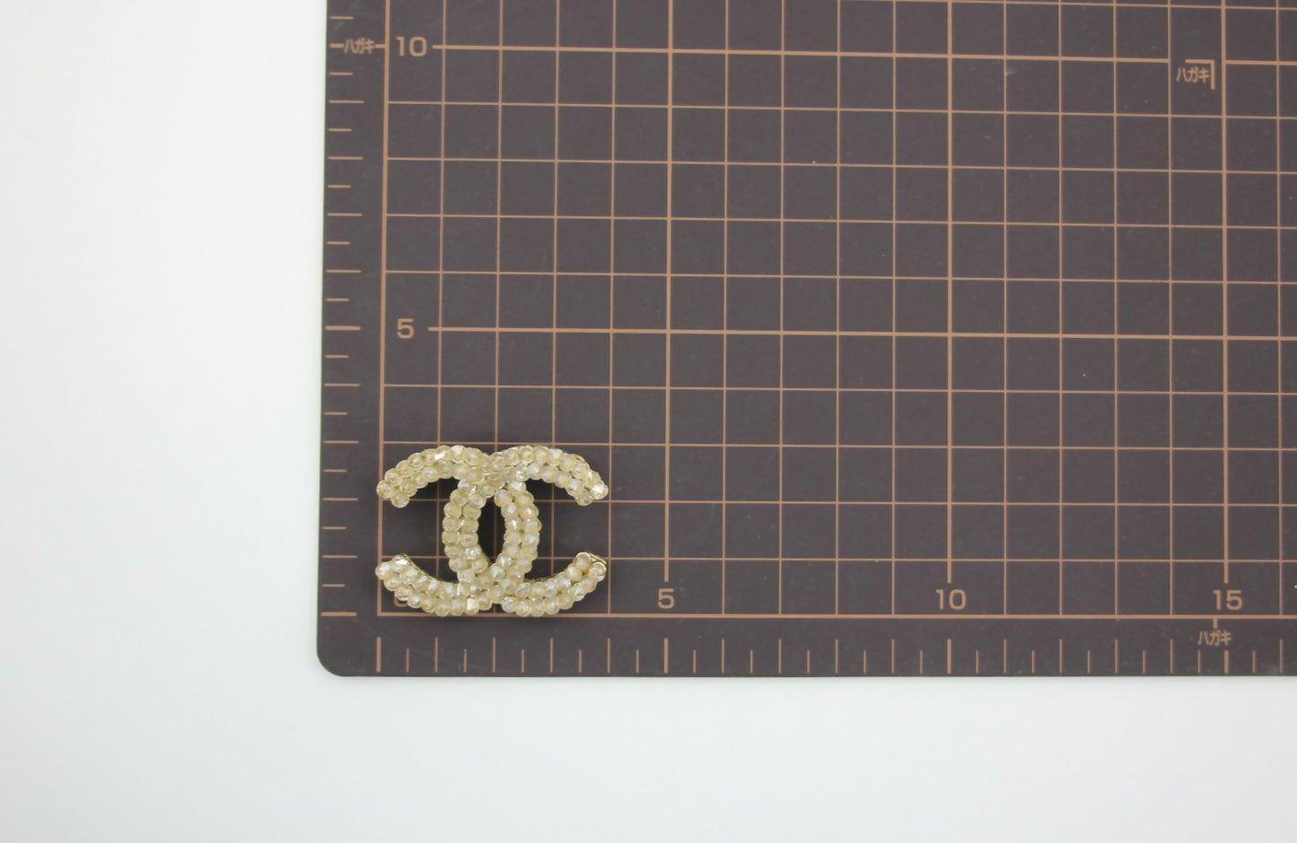 Chanel A12A Rhinestone Beige CC Brooch