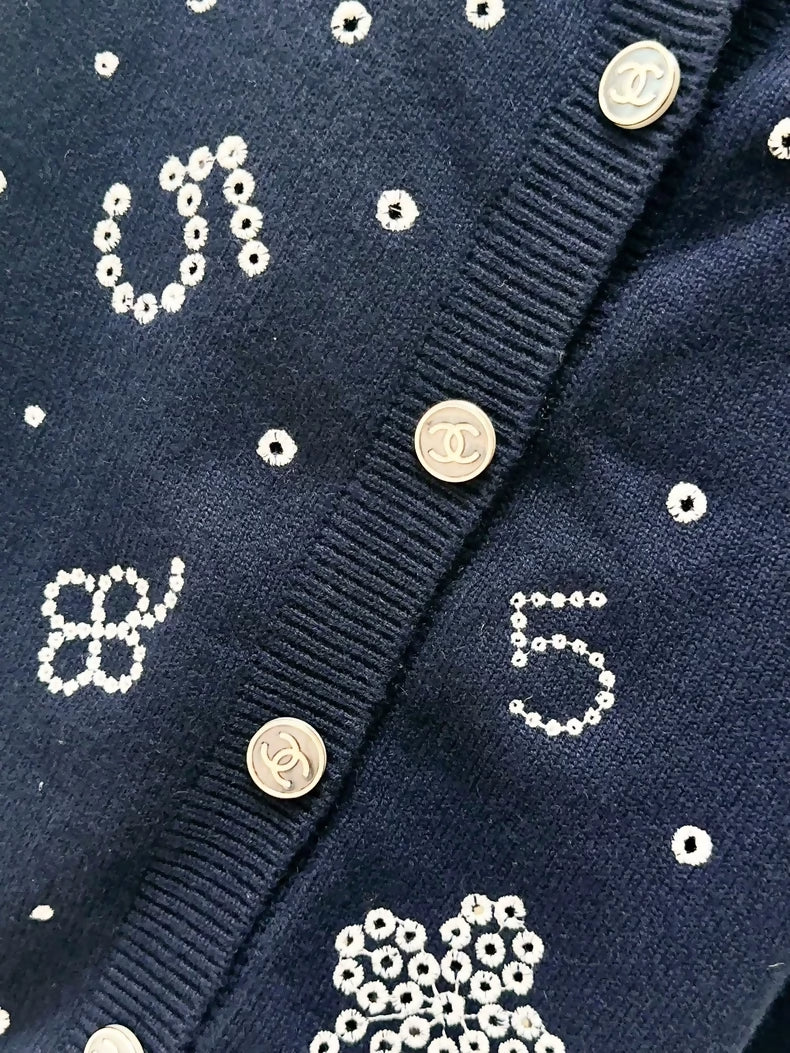 Chanel 24P navy blue, multi-element, knit cardigan.